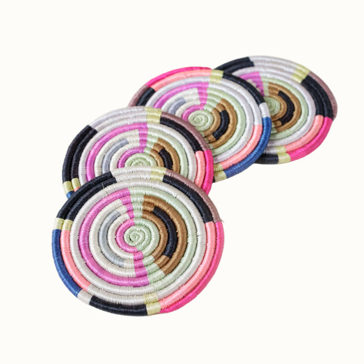 Set of colorful circular coasters on a white background