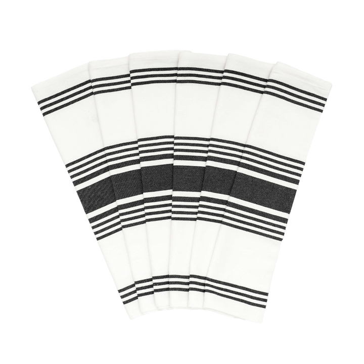 Six white towels with black horizontal stripes, fanned out against a solid white background.