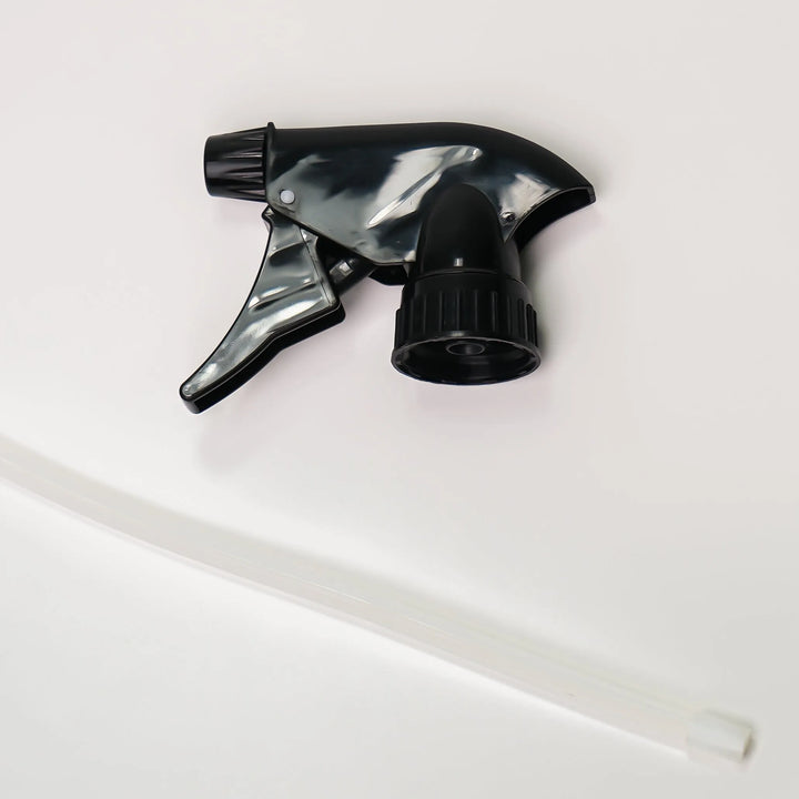 Black and clear spray nozzle on a white background