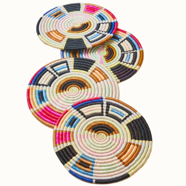Set of colorful woven coasters on a light background