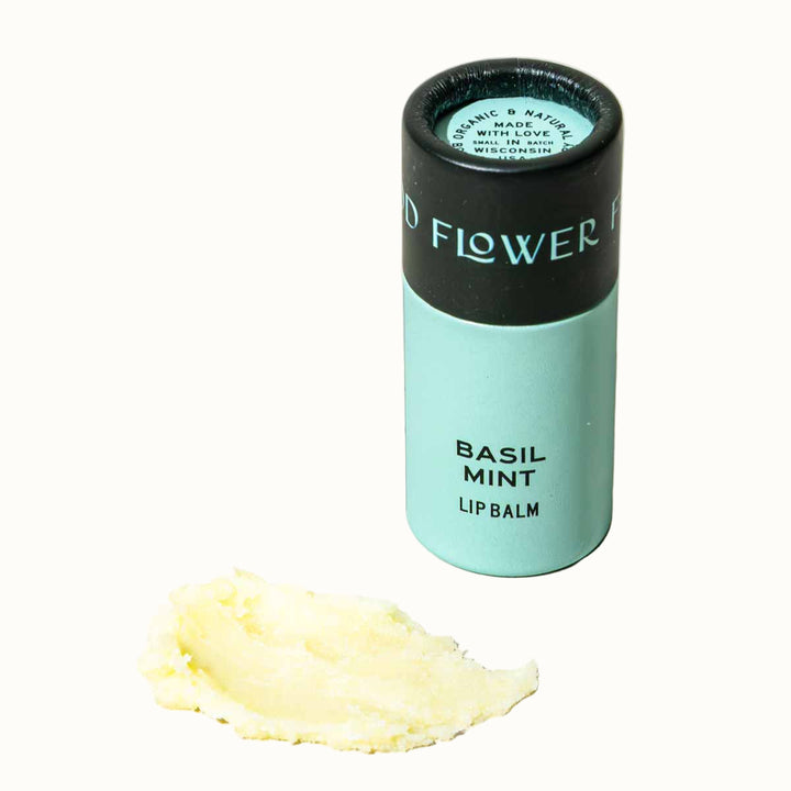Lip balm container labeled &