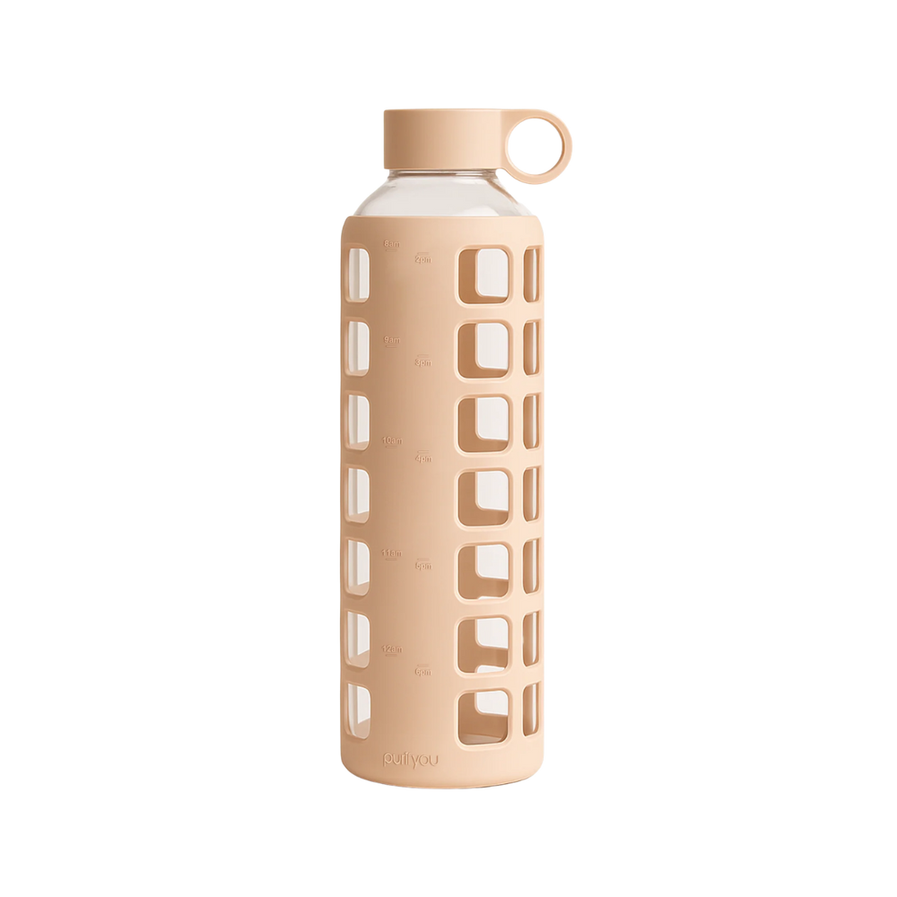 A tall reusable water bottle with a transparent body, a beige cap and loop handle, and a matching beige protective sleeve featuring a grid of square cutouts, shown on a plain white background.