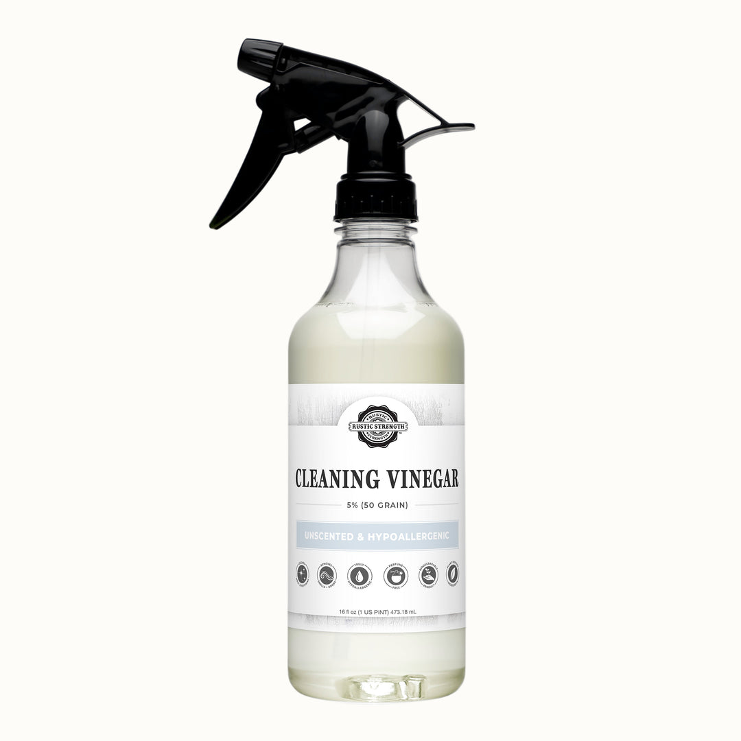 Bottle of cleaning vinegar with a black spray nozzle on a gray background