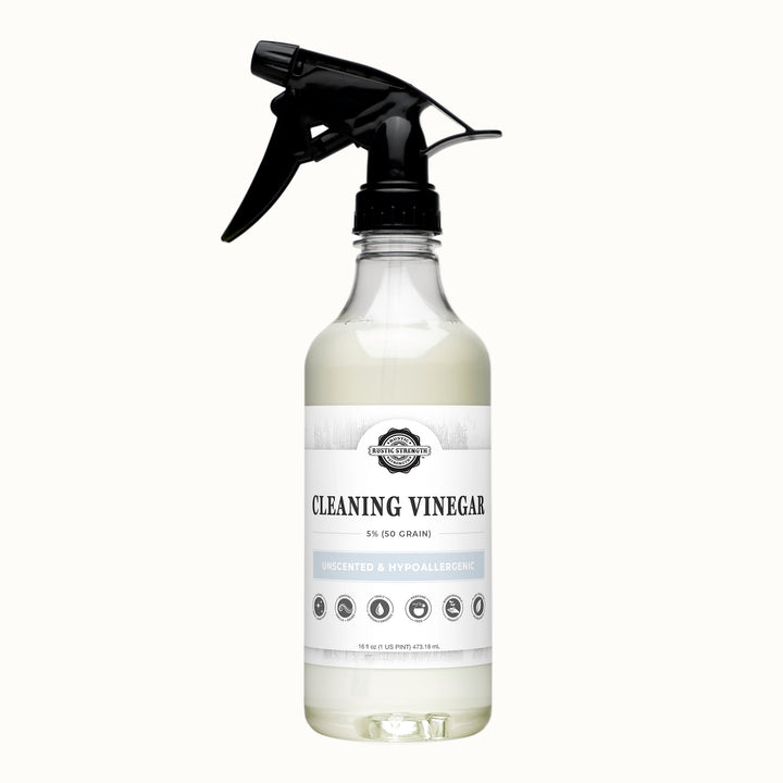 Bottle of cleaning vinegar with a black spray nozzle on a gray background