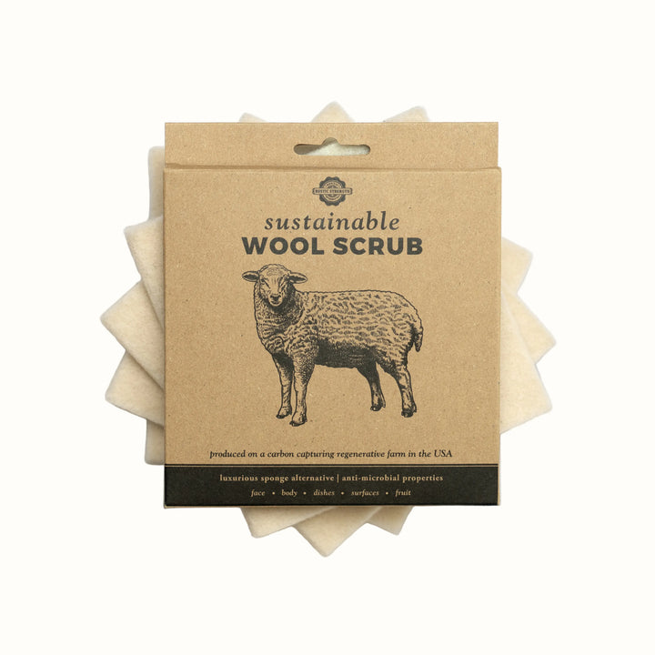 Packaged sustainable wool scrub with a sheep illustration on a white background